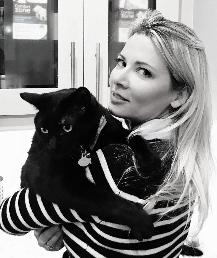 Mieshelle Nagelschneider The Cat Whisperer holding a Black Cat | Cat Behaviorist